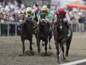 Go Maggie Go with Luis Saez aboard, right, wins the Black-Eyed Susan horse race at Pimlico Race Course as Kinsley Kisses with John Velazquez center and rider Brian Hernandez Jr. rides Ma Can Do It. Photo By Benjamin Rogers, Jr