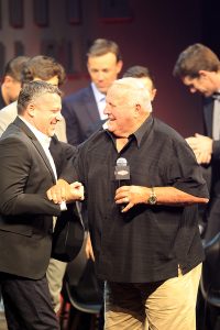 NASCAR Sprint Cup Driver Tony Stewart and Legendary Driver and Owner AJ Foyt meet on stage as Tony's retirement surprise.